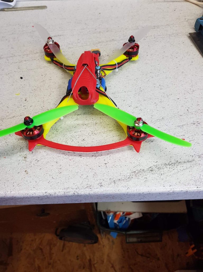 Racing drone fitted with electronics from electronics build log
