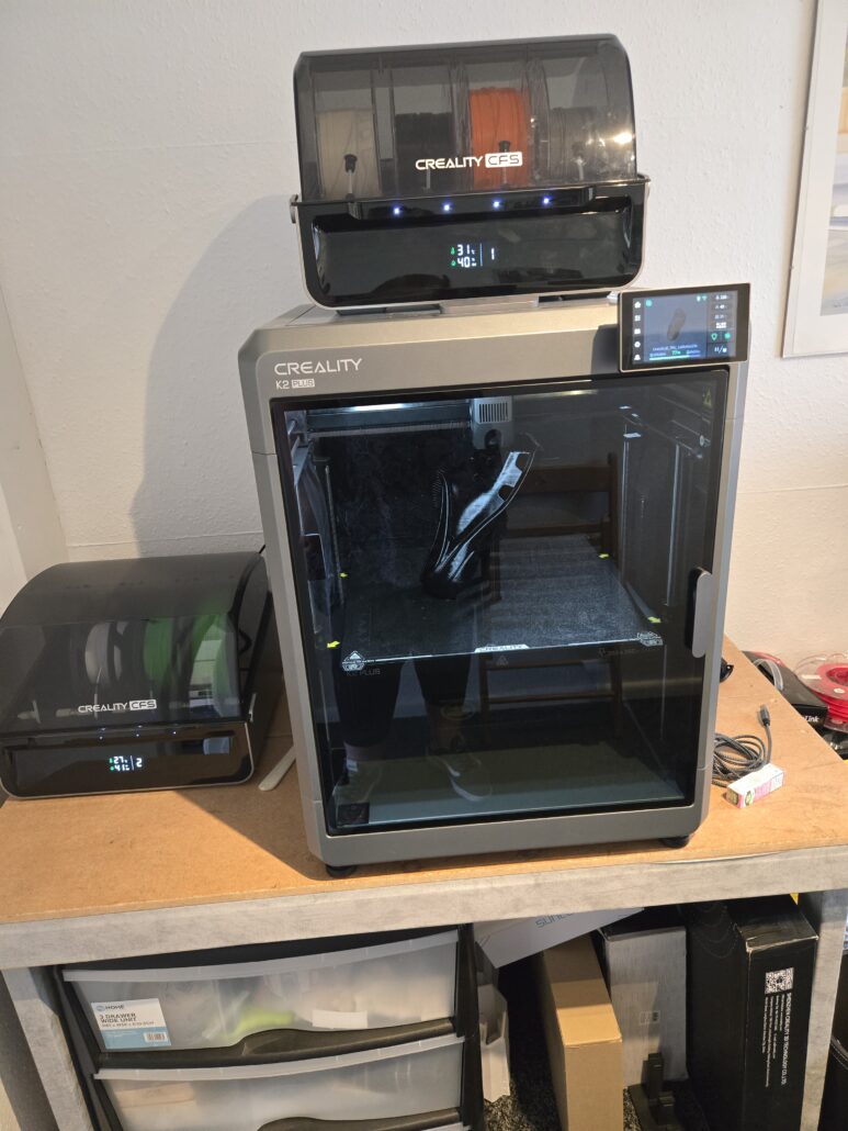 Creality K2 Plus with one CFS situated on top and one to the side